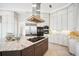 Stylish kitchen with granite countertops, stainless appliances, and modern fixtures at 6202 Pasadena Point Blvd, Gulfport, FL 33707