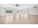 Spacious living room with tile floors, ceiling fans and large windows with waterfront views at 6202 Pasadena Point Blvd, Gulfport, FL 33707