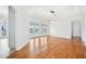 Bright living room with hardwood floors, modern chandelier, and waterfront views at 6202 Pasadena Point Blvd, Gulfport, FL 33707
