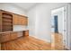 Home office boasts custom built-ins, desk space, and hardwood flooring at 6202 Pasadena Point Blvd, Gulfport, FL 33707