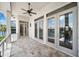 Covered outdoor patio with ceiling fan and views of the waterfront and private dock at 6202 Pasadena Point Blvd, Gulfport, FL 33707