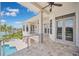 Covered patio with a pool and water views at 6202 Pasadena Point Blvd, Gulfport, FL 33707