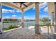 A covered patio overlooking a waterway on a sunny day at 6202 Pasadena Point Blvd, Gulfport, FL 33707