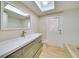 Bathroom with vanity, subway tile walls, bathtub, and modern fixtures at 6528 Santiago Ct, Apollo Beach, FL 33572