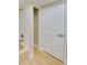 Bathroom with tub, shower, updated fixtures, and an exit door at 6528 Santiago Ct, Apollo Beach, FL 33572