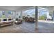 Screened in lanai with ample seating and dining areas for relaxing and entertaining at 6528 Santiago Ct, Apollo Beach, FL 33572