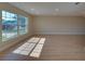 Spacious room bathed in natural light showcases beautiful luxury vinyl plank floors and recessed lighting at 6528 Santiago Ct, Apollo Beach, FL 33572