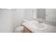 Bathroom features a vanity with a sink, a toilet, and a large mirror at 6831 Dartmouth Hill St, Riverview, FL 33578