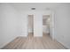 Spacious room features wood floors and doorways leading to other rooms at 6831 Dartmouth Hill St, Riverview, FL 33578
