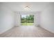 Bright dining room with new flooring and a large window overlooking the pond and backyard at 6831 Dartmouth Hill St, Riverview, FL 33578