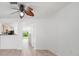 Bright, open living room with luxury vinyl plank flooring and a view of the kitchen and backyard at 6831 Dartmouth Hill St, Riverview, FL 33578