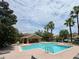 Community pool with a clear blue pool, brick patio, palm trees, lounge chairs, and a clubhouse cabana at 6831 Dartmouth Hill St, Riverview, FL 33578
