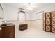 Minimalist bedroom with neutral walls, tile flooring, two windows with blinds, and a comfortable setting at 736 85Th N Ave, St Petersburg, FL 33702