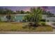 Charming single-story home with a well-manicured front yard and beautiful landscaping at 736 85Th N Ave, St Petersburg, FL 33702
