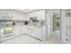 Bright, all-white kitchen with modern appliances and ample counter space at 736 85Th N Ave, St Petersburg, FL 33702