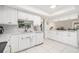 Modern kitchen featuring white cabinets, granite countertops, and stainless steel appliances at 736 85Th N Ave, St Petersburg, FL 33702