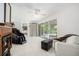 Bright living room featuring a fireplace, sliding glass doors, and tile flooring at 736 85Th N Ave, St Petersburg, FL 33702