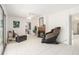 Inviting living room with fireplace, neutral decor, and tile flooring at 736 85Th N Ave, St Petersburg, FL 33702