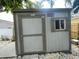 Exterior view of a shed with a window and door, offering storage or hobby space at 736 85Th N Ave, St Petersburg, FL 33702