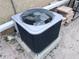 Outdoor home air conditioner unit on concrete base at 7421 Moravian Dr, Port Richey, FL 34668