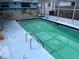 Enclosed pool with beach themed mural on the wall at 7421 Moravian Dr, Port Richey, FL 34668