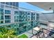 Relaxing balcony area with comfortable seating, perfect for enjoying the city view at 912 Channelside Dr # 2710, Tampa, FL 33602
