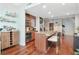 Kitchen with a large island, stainless steel appliances, and wood flooring at 912 Channelside Dr # 2710, Tampa, FL 33602