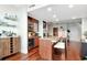 Kitchen featuring an island with seating, stainless appliances, and wood cabinets at 912 Channelside Dr # 2710, Tampa, FL 33602