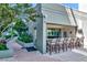 An outdoor kitchen is complete with a serving window and a bar and stool area, ready for entertaining at 912 Channelside Dr # 2710, Tampa, FL 33602