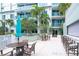 Outdoor patio with comfortable seating and lush tropical plants at 912 Channelside Dr # 2710, Tampa, FL 33602
