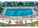 Aerial view of sparkling pool area, perfect for relaxation, surrounded by stylish lounge chairs at 912 Channelside Dr # 2710, Tampa, FL 33602