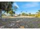 Large backyard with a walking path and mature trees at 9127 Irondale Ln, Hudson, FL 34667