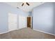 Spacious carpeted bedroom with two closets, and fan at 9127 Irondale Ln, Hudson, FL 34667