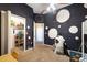 bedroom with carpeted floors, walk-in closet, ceiling fan, and rocket ship decor at 9127 Irondale Ln, Hudson, FL 34667