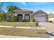 Charming single-Gathering home with a well-manicured lawn and a two-car garage, perfect for suburban living at 9127 Irondale Ln, Hudson, FL 34667