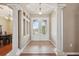 Grand foyer with tile flooring, decorative columns, and a view of the dining area at 9127 Irondale Ln, Hudson, FL 34667