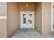 Elegant double front doors with glass panels and a classic exterior light fixture at 9127 Irondale Ln, Hudson, FL 34667