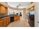 Kitchen with granite countertops, stainless steel appliances, wood cabinets and bar top at 9127 Irondale Ln, Hudson, FL 34667