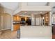 Kitchen with granite countertops, mosaic backsplash, wood cabinets and stainless steel appliances at 9127 Irondale Ln, Hudson, FL 34667