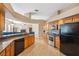 Kitchen with granite countertops, stainless steel appliances, mosaic backsplash, and wood cabinets at 9127 Irondale Ln, Hudson, FL 34667