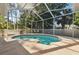 Screened-in pool area with a plunge pool and chairs at 9127 Irondale Ln, Hudson, FL 34667