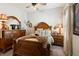 Well-appointed bedroom boasts a ceiling fan, wood furniture, and ample natural light at 922 Grand Cresta Ave, Brandon, FL 33511