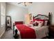 Cozy bedroom features a decorative headboard, shutters, and a ceiling fan at 922 Grand Cresta Ave, Brandon, FL 33511