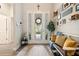 Inviting foyer with a decorative front door, coat rack, and neutral decor at 922 Grand Cresta Ave, Brandon, FL 33511