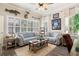 Inviting living room with plantation shutters, ceiling fan, and comfortable seating arrangement at 922 Grand Cresta Ave, Brandon, FL 33511