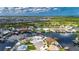 An expansive aerial perspective captures waterfront residences, boat docks, and picturesque views within a tranquil community at 927 Golf Island Dr, Apollo Beach, FL 33572