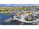 Beautiful aerial view of a waterfront home with a screened pool and a private boat dock at 927 Golf Island Dr, Apollo Beach, FL 33572