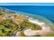 Aerial view of Apollo Beach waterfront with grassy and sandy beach areas, with an ocean view at 927 Golf Island Dr, Apollo Beach, FL 33572