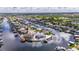 An expansive aerial perspective captures waterfront residences, boat docks, and picturesque views within a tranquil community at 927 Golf Island Dr, Apollo Beach, FL 33572