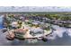 Beautiful aerial view of a waterfront community featuring houses with private docks and stunning water views at 927 Golf Island Dr, Apollo Beach, FL 33572